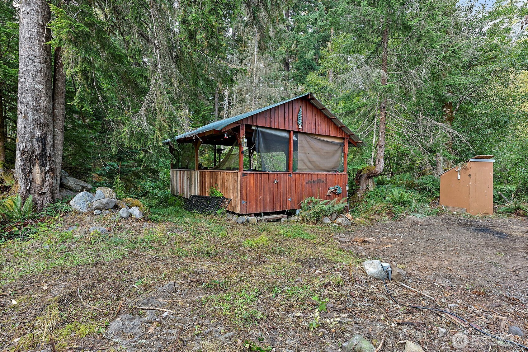 270 Skate Creek Road North Ashford, WA 98304 - Photo 24 of 36 a view of a small house with a yard