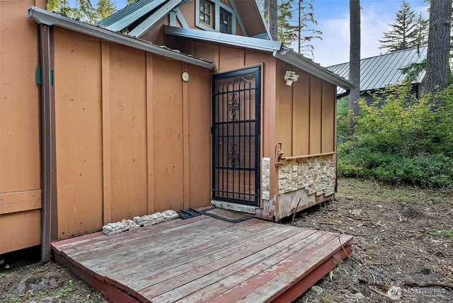 a wooden door in front of a house