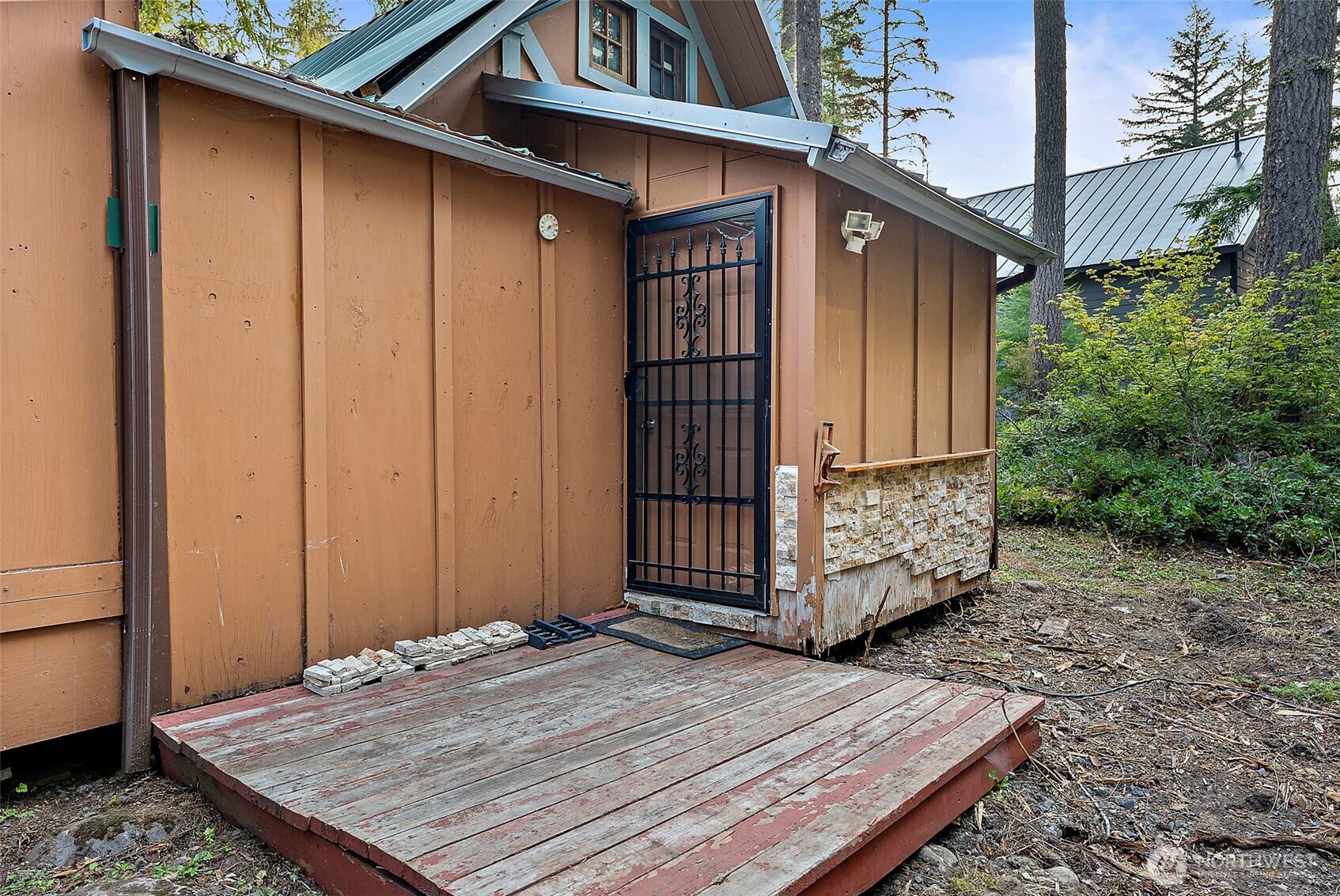 270 Skate Creek Road North Ashford, WA 98304 - Photo 28 of 36 a wooden door in front of a house