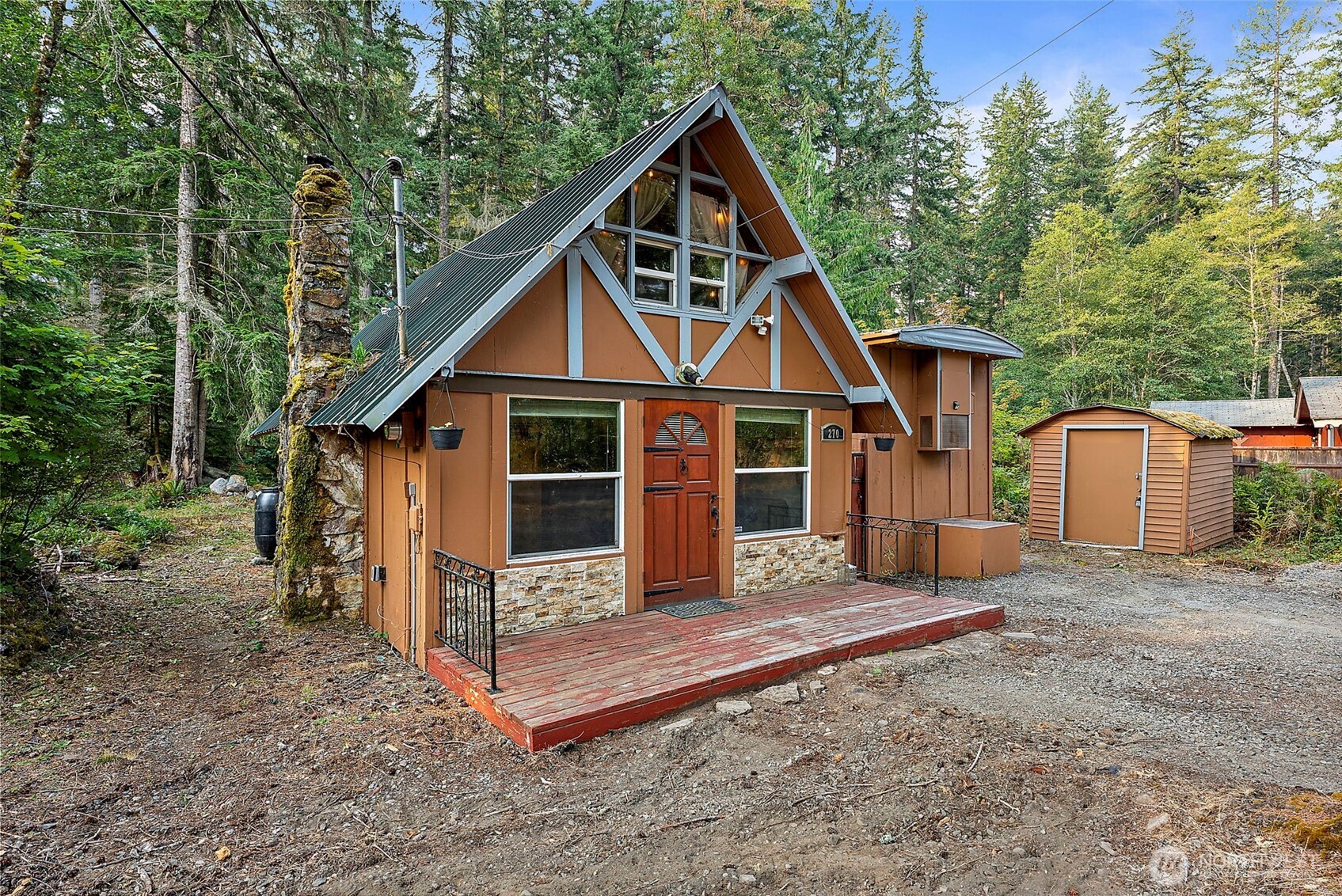 270 Skate Creek Road North Ashford, WA 98304 - Photo 3 of 36 a front view of a house with wooden fence
