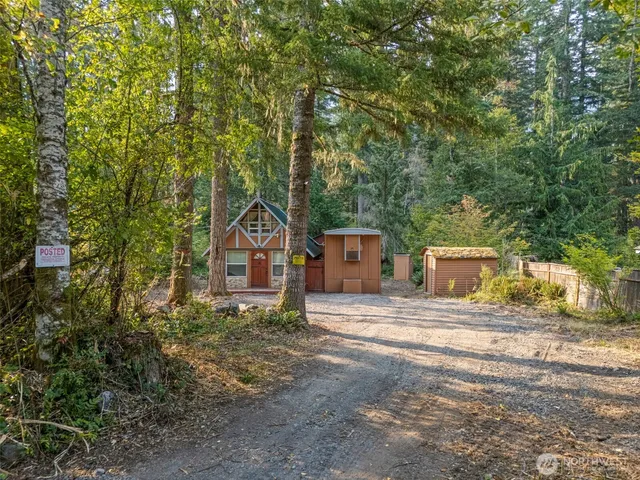 a house with trees in front of it
