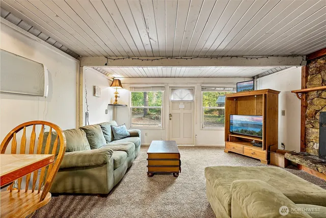 a bedroom with furniture and a window