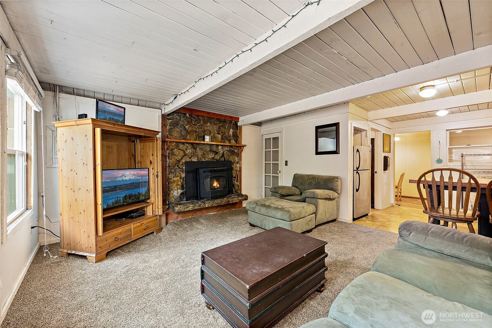270 Skate Creek Road North Ashford, WA 98304 - Photo 8 of 36 a living room with furniture and a fireplace