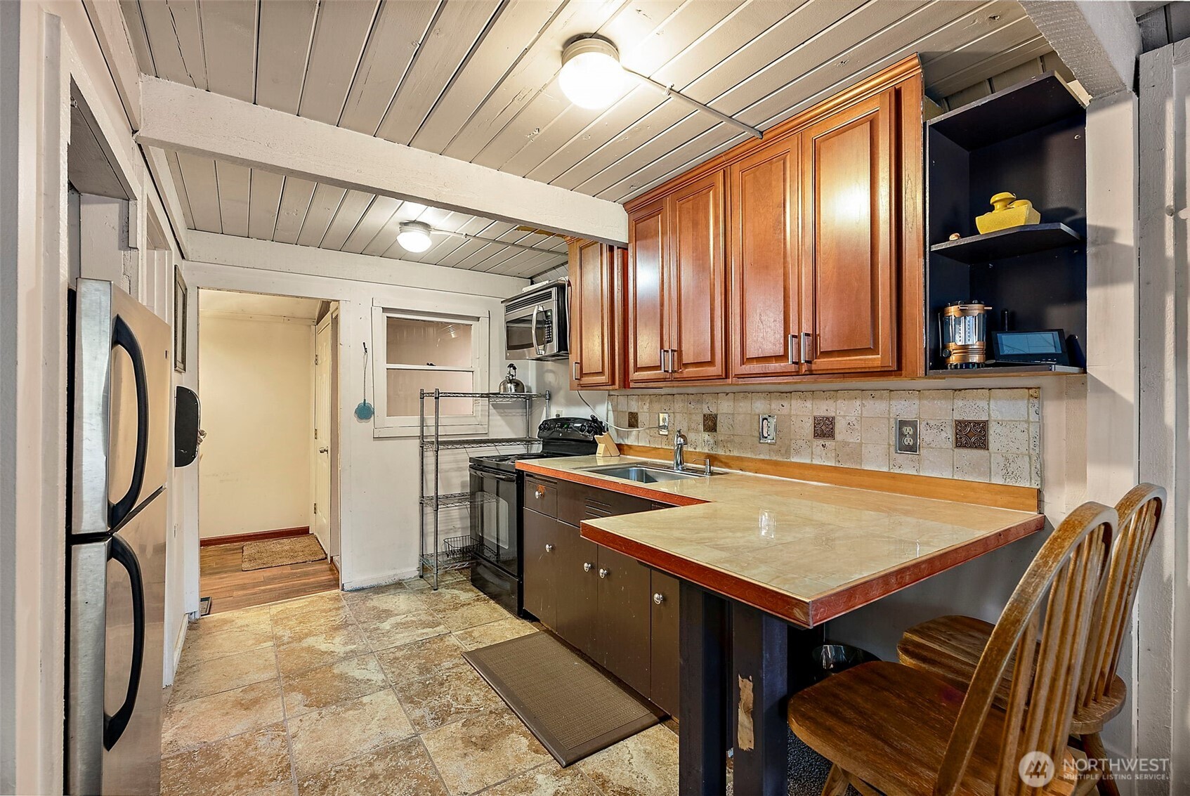 270 Skate Creek Road North Ashford, WA 98304 - Photo 10 of 36 a kitchen that has a sink a stove and chairs
