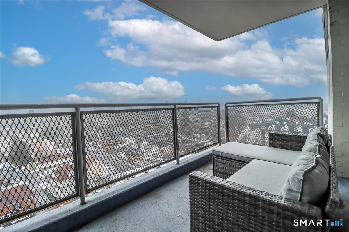 30 Glenbrook Road, Unit 10F Stamford, CT 06902 - Photo 17 of 30 a balcony with furniture