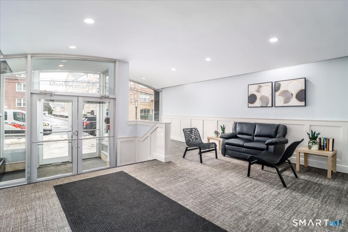 30 Glenbrook Road, Unit 10F Stamford, CT 06902 - Photo 29 of 30 a living room with furniture and wooden floor