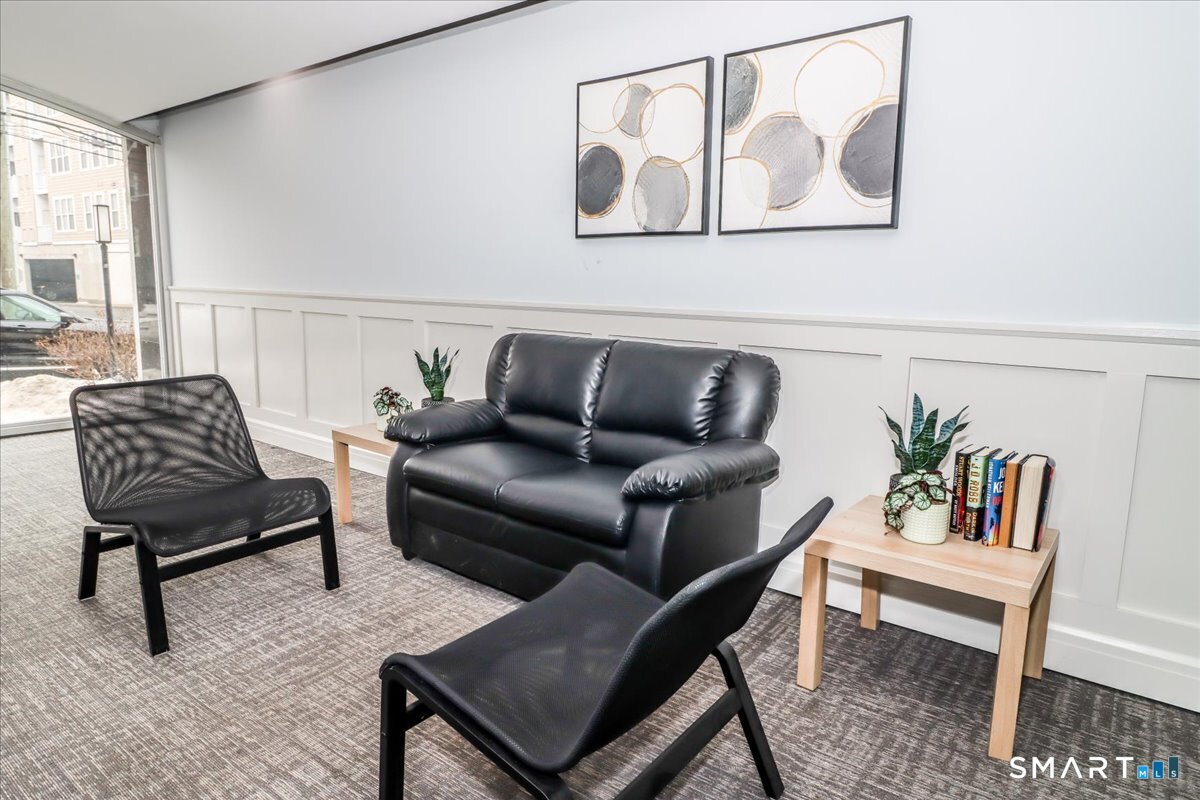30 Glenbrook Road, Unit 10F Stamford, CT 06902 - Photo 30 of 30 a living room with furniture