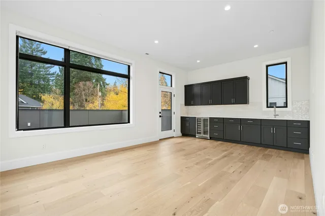 a bathroom with a granite countertop double vanity sink a mirror and a