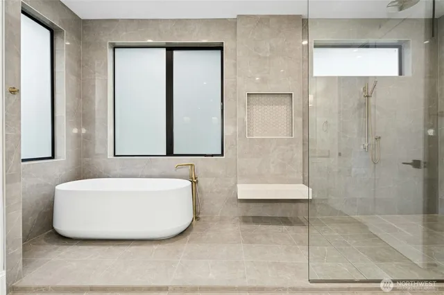 a front view of a house with a garden and plants