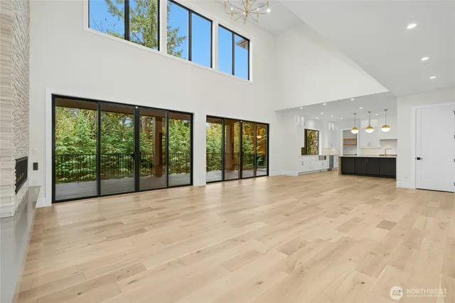 a kitchen with stainless steel appliances a stove and white cabinets