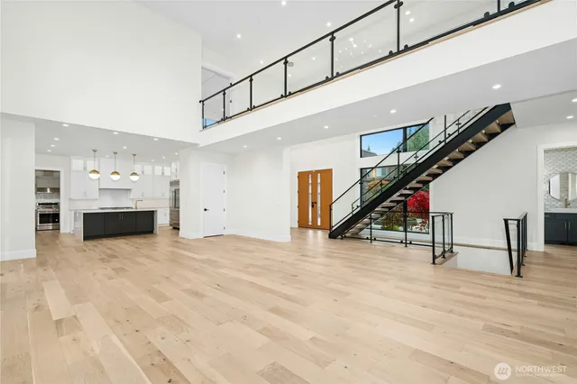 a kitchen with a sink a stove and cabinets