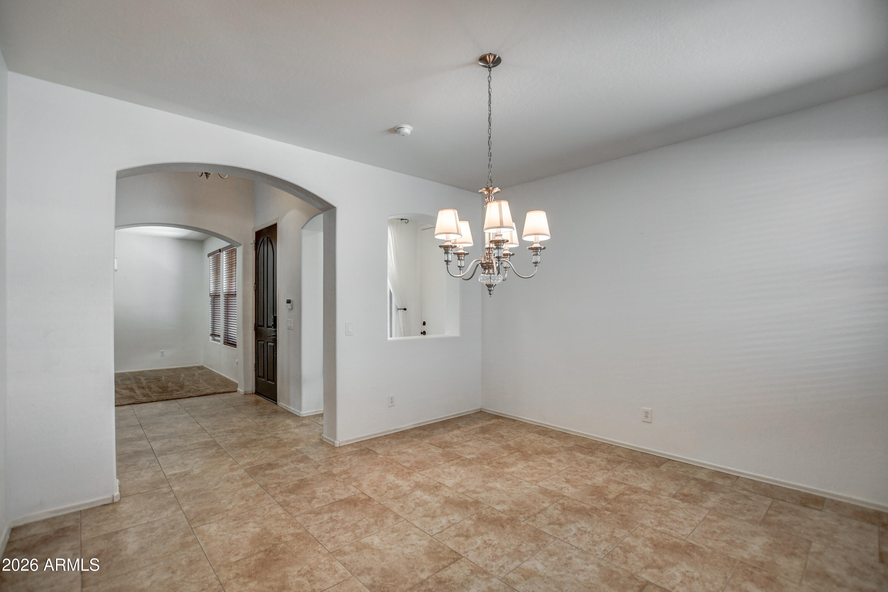 3078 East Muirfield Street Gilbert, AZ 85298 - Photo 22 of 92 a view of a chandelier in a room