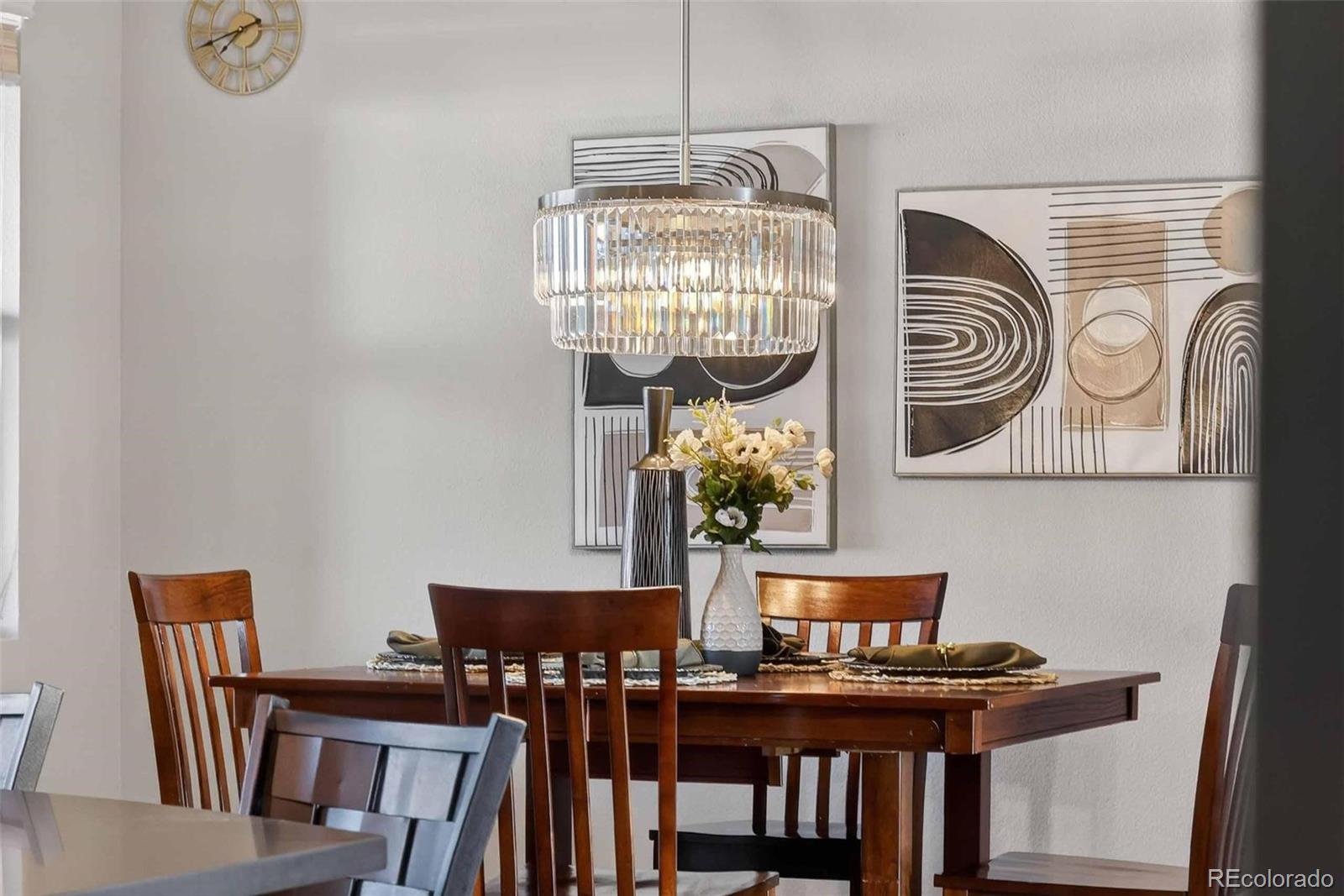 10204 RidgeGate Circle Lone Tree, CO 80124 - Photo 4 of 11 a view of a dining room with furniture and chandelier