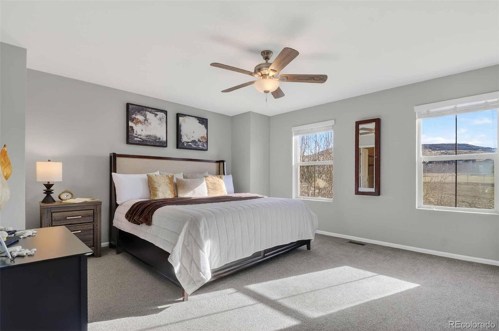 10204 RidgeGate Circle Lone Tree, CO 80124 - Photo 5 of 11 a bed room with a bed and a window