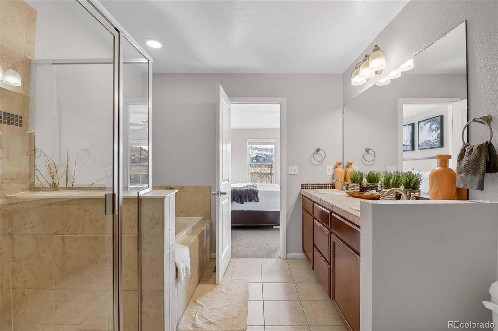 10204 RidgeGate Circle Lone Tree, CO 80124 - Photo 6 of 11 a kitchen with a sink and a stove top oven