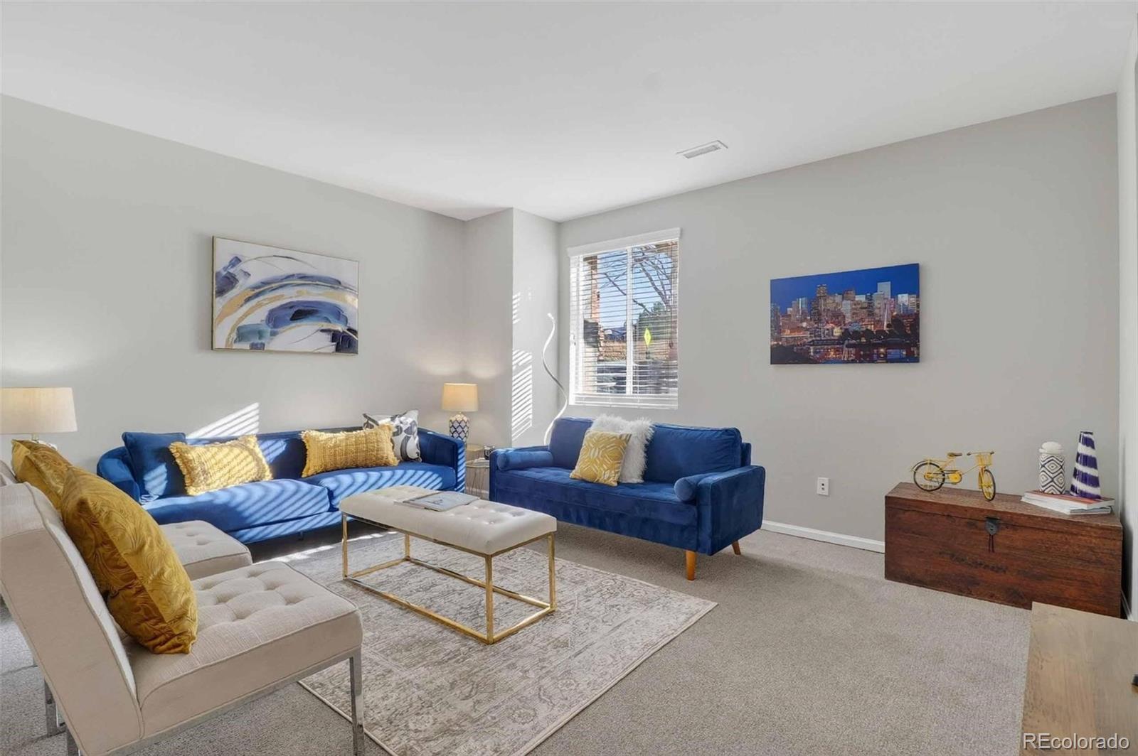 10204 RidgeGate Circle Lone Tree, CO 80124 - Photo 9 of 11 a living room with furniture and a large window