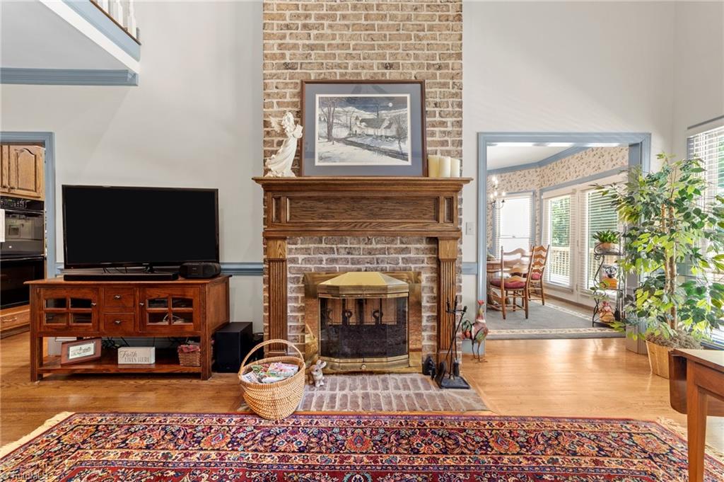 241 Stanley Road Stokesdale, NC 27357 - Photo 15 of 50 Double sided fireplace in living room