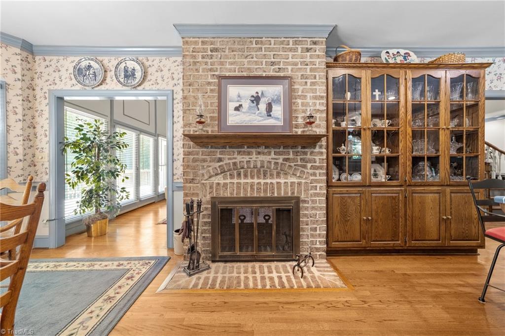 241 Stanley Road Stokesdale, NC 27357 - Photo 17 of 50 Double sided fireplace in dining room