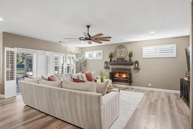 a living room with furniture and a fireplace