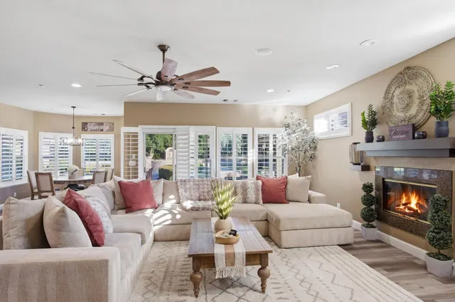 a living room with furniture and a fireplace