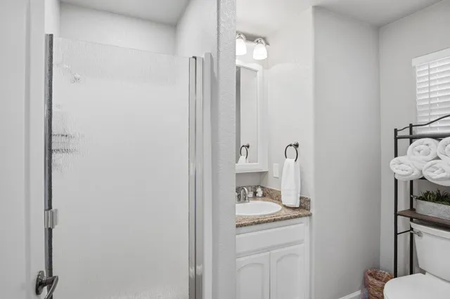 a kitchen with refrigerator a sink and chairs