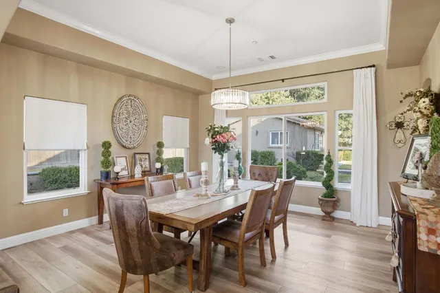 a view of a dining room with furniture window and wooden floor