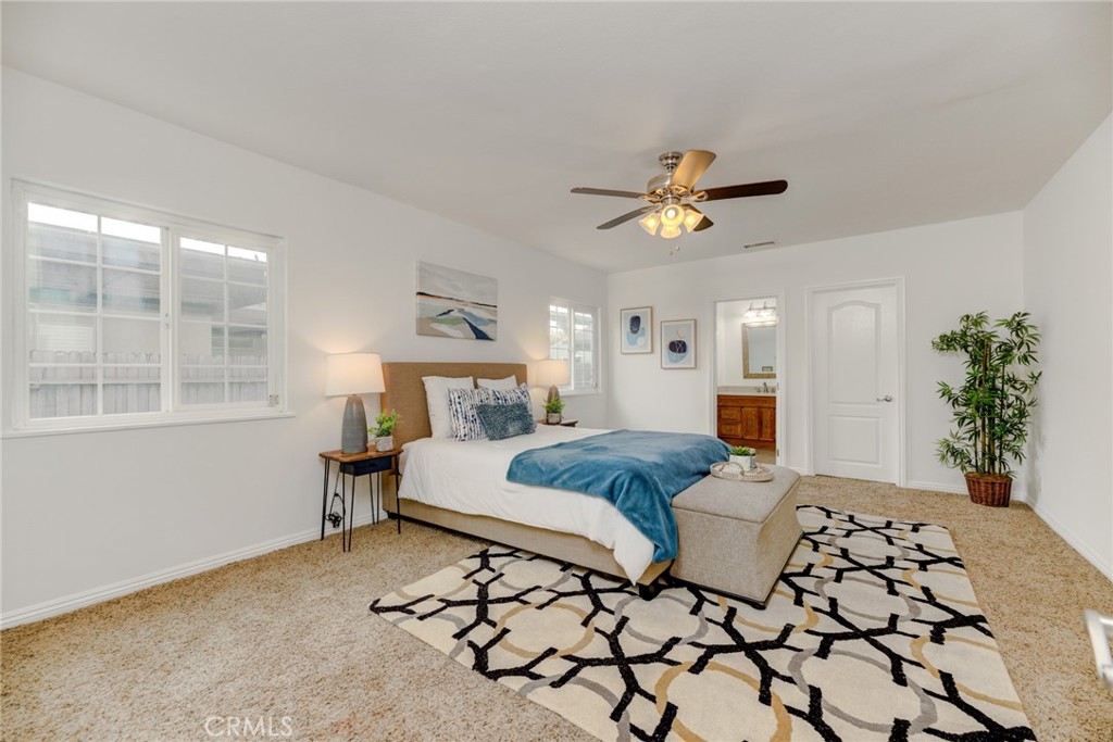 3816 Chatwin Avenue Long Beach, CA 90808 - Photo 11 of 60 a bedroom with a bed and a chandelier