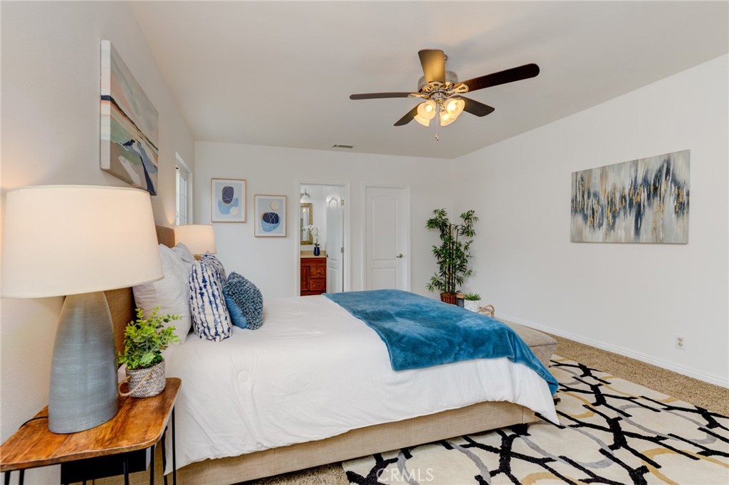 3816 Chatwin Avenue Long Beach, CA 90808 - Photo 13 of 60 a bedroom with a bed and a chandelier