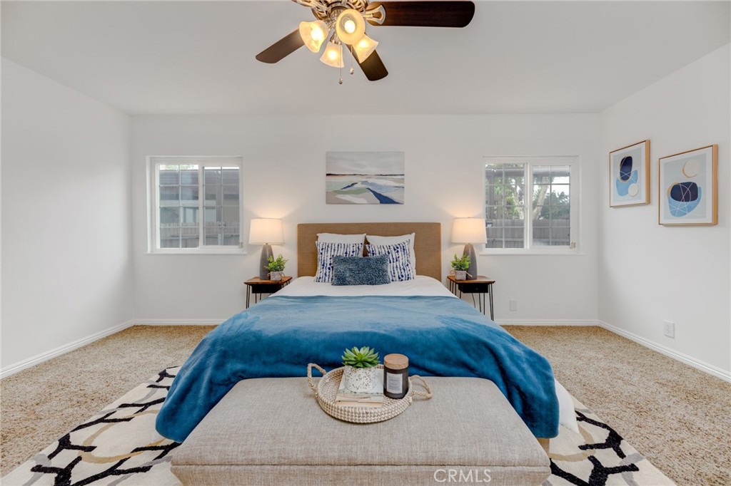 3816 Chatwin Avenue Long Beach, CA 90808 - Photo 14 of 60 a bedroom with a bed and wooden floor