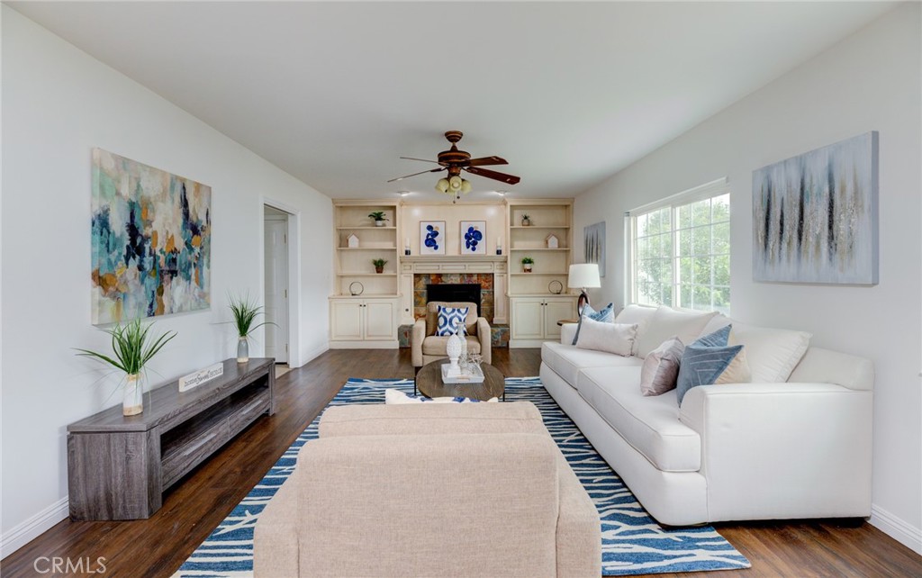 3816 Chatwin Avenue Long Beach, CA 90808 - Photo 27 of 60 a living room with furniture and a fireplace