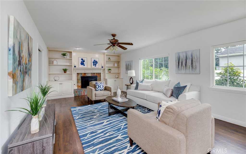 3816 Chatwin Avenue Long Beach, CA 90808 - Photo 28 of 60 a living room with furniture a fireplace and a window