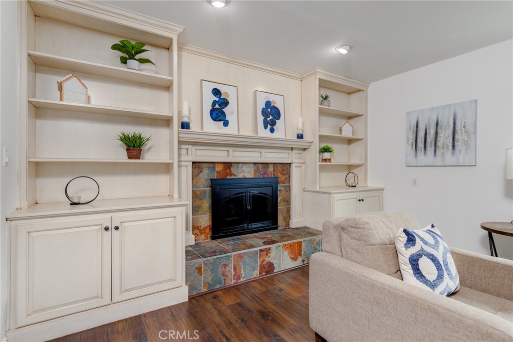 3816 Chatwin Avenue Long Beach, CA 90808 - Photo 33 of 60 a living room with furniture and a fireplace