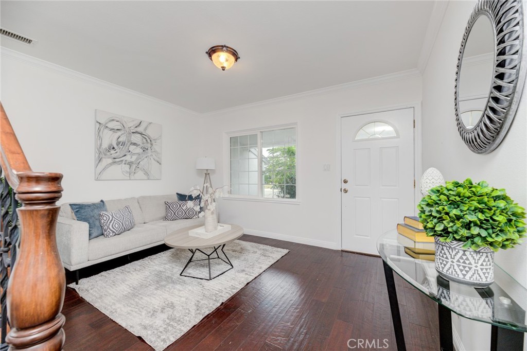 3816 Chatwin Avenue Long Beach, CA 90808 - Photo 4 of 60 a living room with furniture and a potted plant