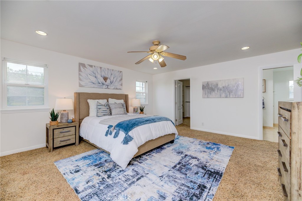 3816 Chatwin Avenue Long Beach, CA 90808 - Photo 41 of 60 a bedroom with a bed and a chandelier