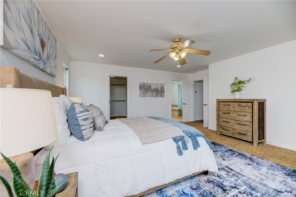 3816 Chatwin Avenue Long Beach, CA 90808 - Photo 42 of 60 a bedroom with bed and a chandelier