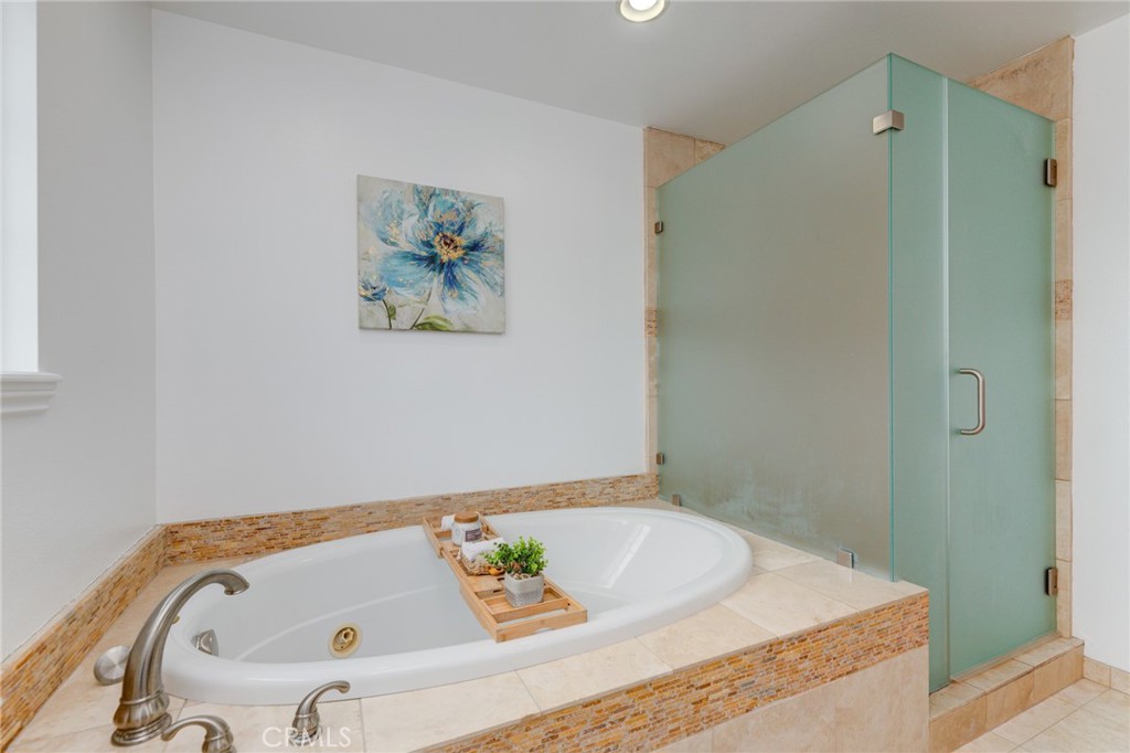 3816 Chatwin Avenue Long Beach, CA 90808 - Photo 48 of 60 a bathroom with a tub and shower