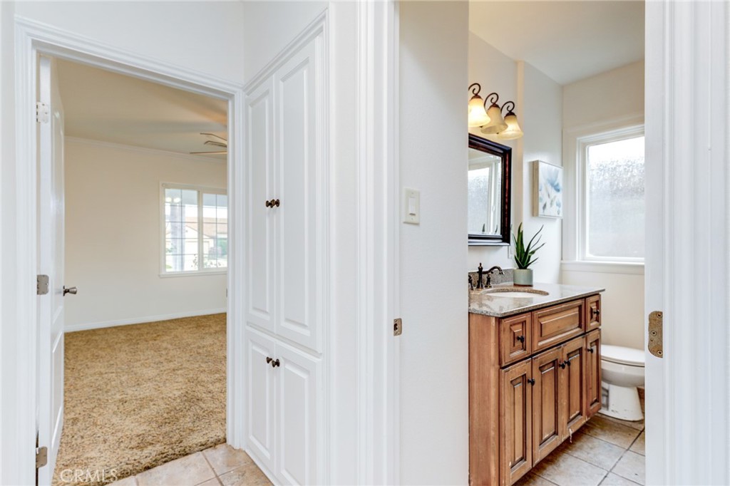 3816 Chatwin Avenue Long Beach, CA 90808 - Photo 7 of 60 a bathroom with a sink a toilet and mirror