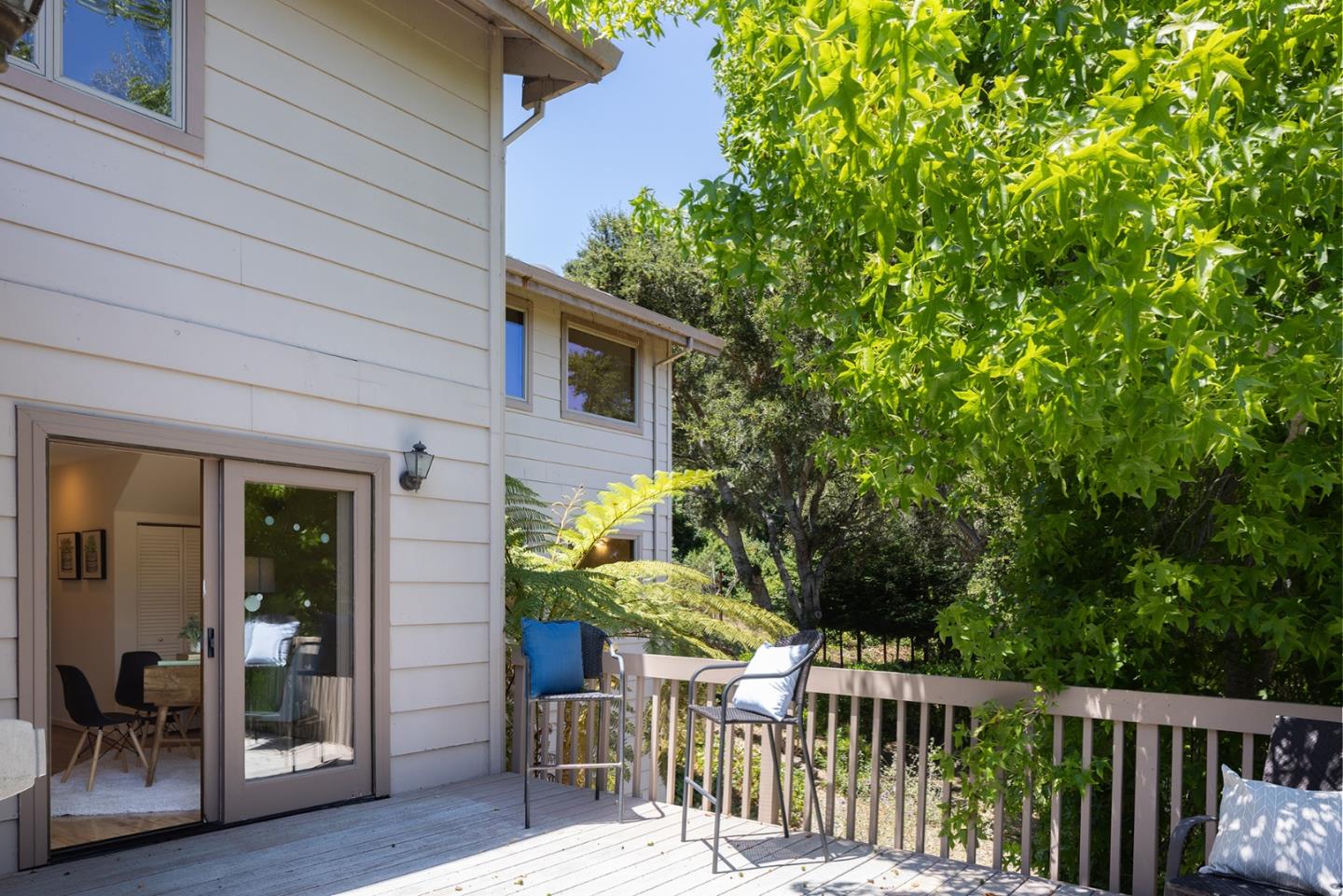 27461 Schulte Road Carmel, CA 93923 - Photo 15 of 33 a view of a patio with table and chairs and potted plants