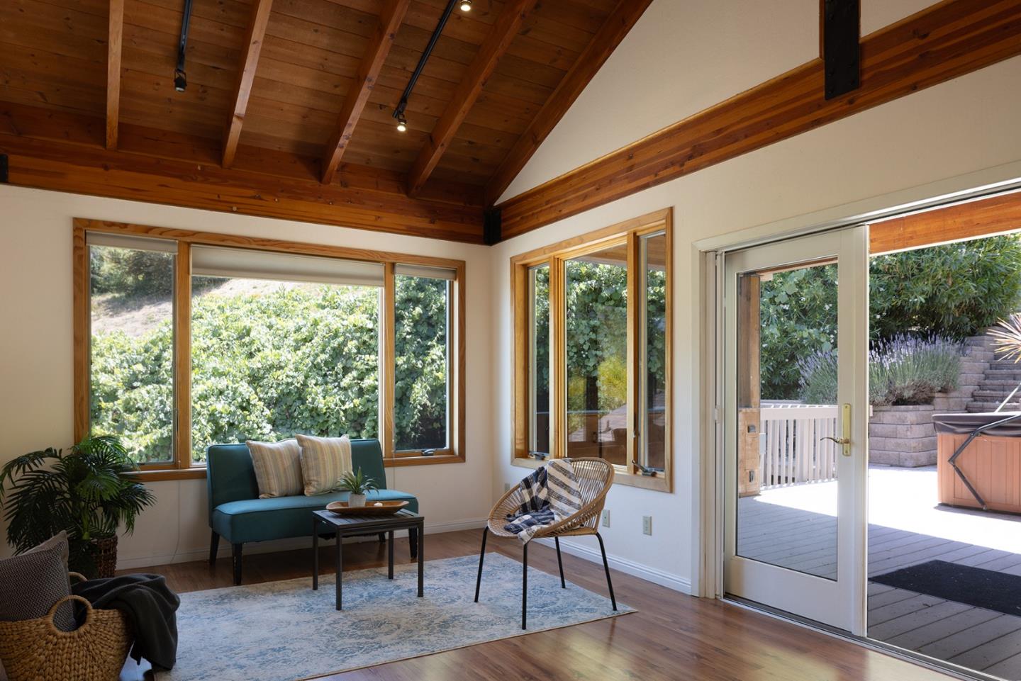 27461 Schulte Road Carmel, CA 93923 - Photo 19 of 33 a living room with furniture floor to ceiling window and wooden floor