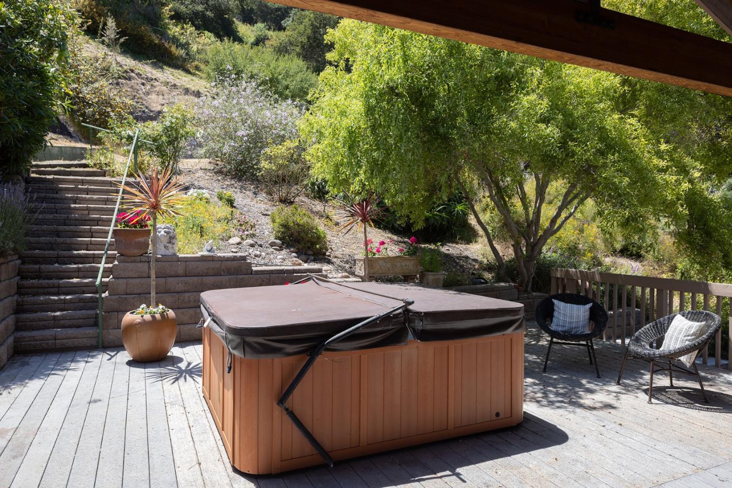 27461 Schulte Road Carmel, CA 93923 - Photo 22 of 33 a view of a patio with table and chairs and wooden floor