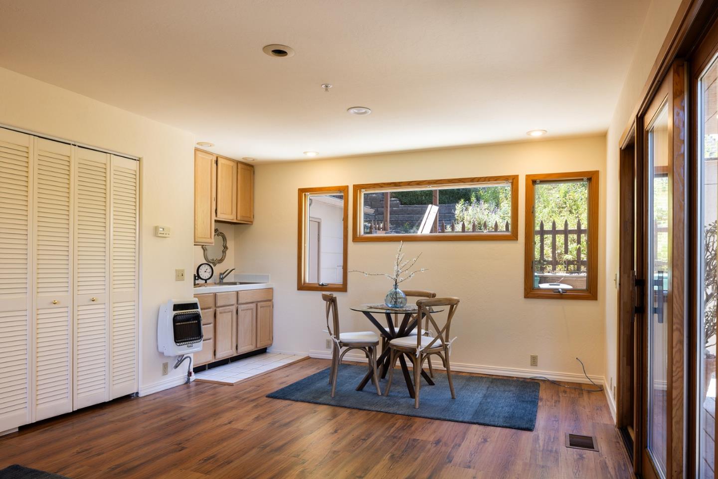 27461 Schulte Road Carmel, CA 93923 - Photo 26 of 33 a view of a livingroom with furniture a ceiling fan and wooden floor