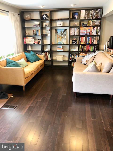 15 Robin Ridge Court Parkville, MD 21234 - Photo 2 of 15 a living room with furniture and a book shelf