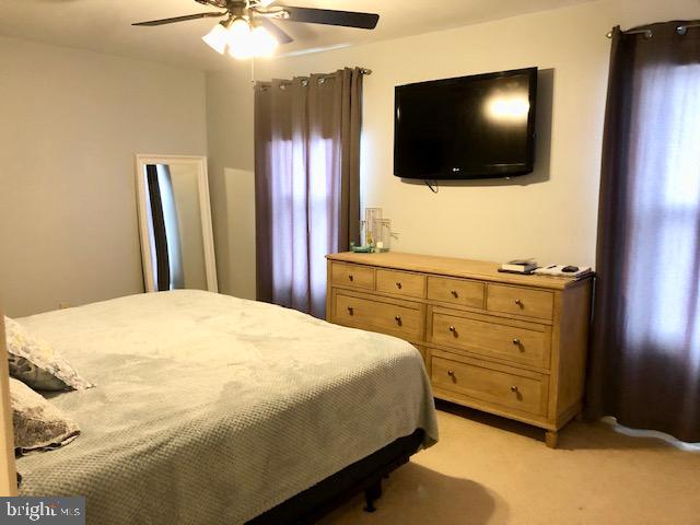 15 Robin Ridge Court Parkville, MD 21234 - Photo 10 of 15 a bedroom with a bed and a flat screen tv