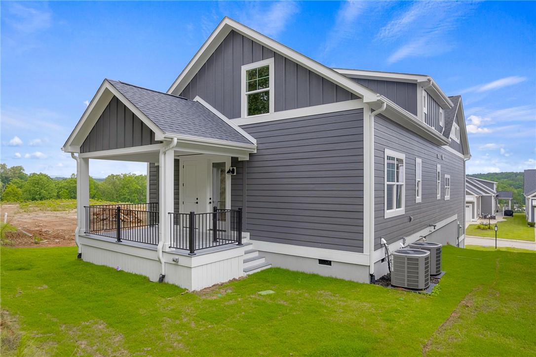 1230 Melton Road, Unit 216 West Union, SC 29696 - Photo 2 of 49 A striking gray facade with crisp white trim and a welcoming covered porch.