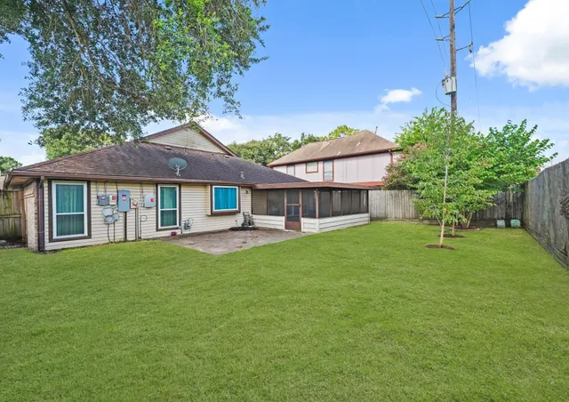 a front view of a house with a yard and porch