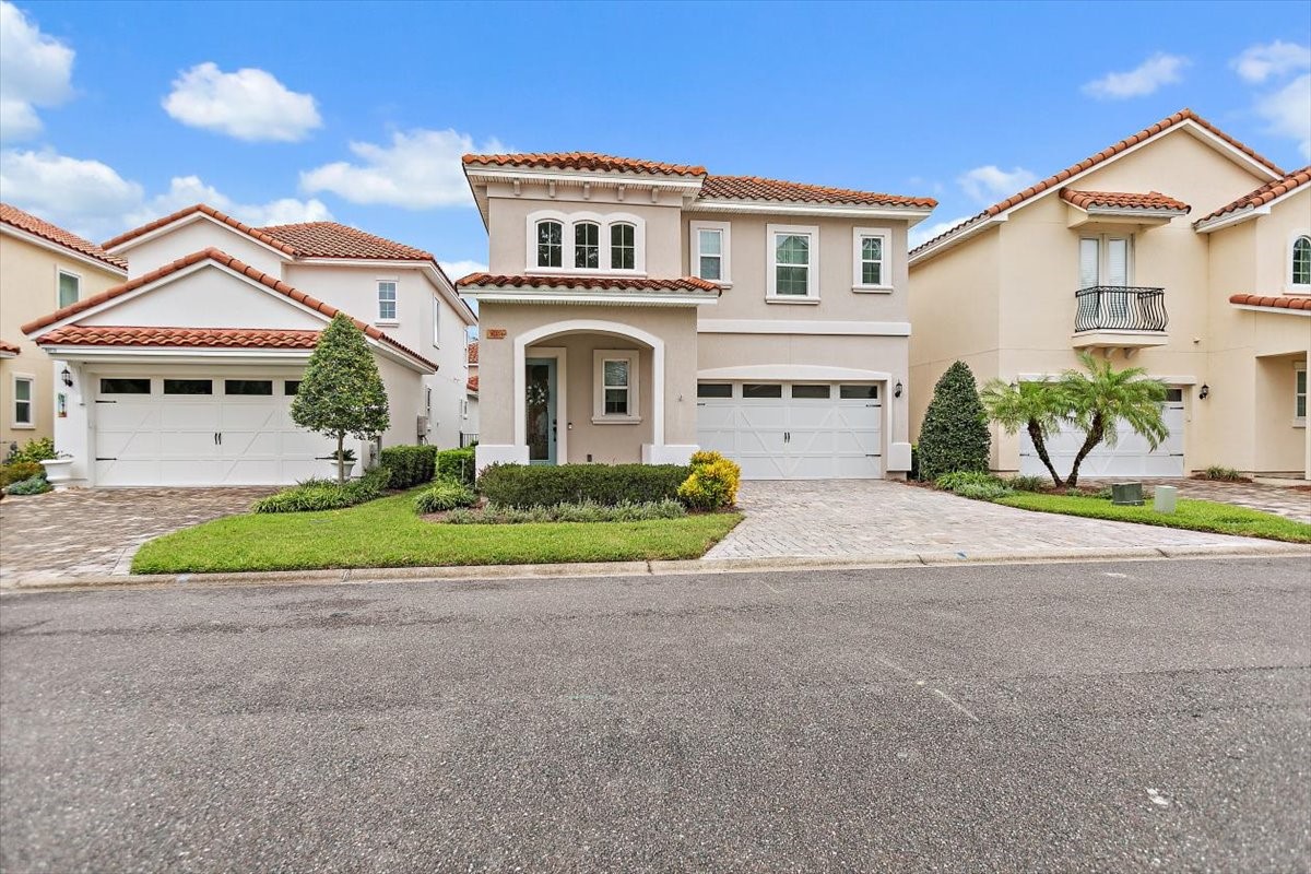 a front view of a house with a garden and porch