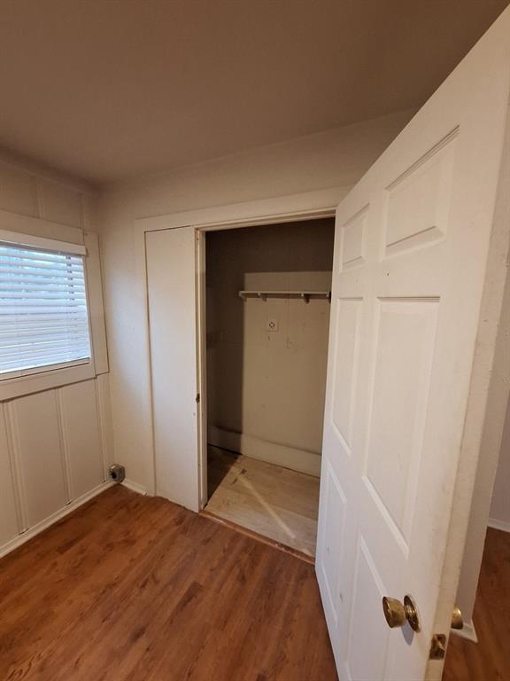 2312 Fincher Road Haltom City, TX 76117 - Photo 12 of 13 a view of hallway with closet and wooden floor
