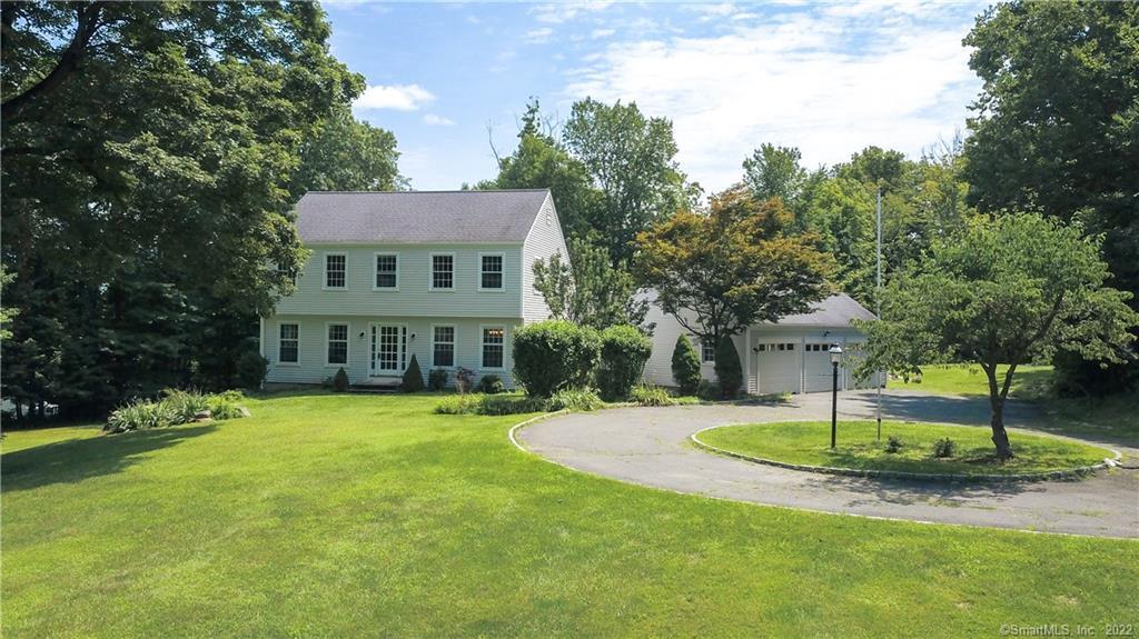 556 Ridgebury Road Ridgefield, CT 06877 - Photo 1 of 1 a view of a house with a big yard and palm trees