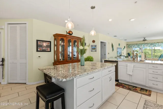 a kitchen with sink and cabinets