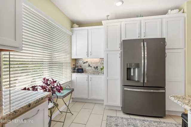 a view of a living room and bedroom